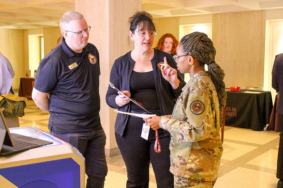 Carrie Meyers (center), director of education and workforce talent at FSU InSPIRE, speaking with a student. (Elliott Finebloom/LSI)