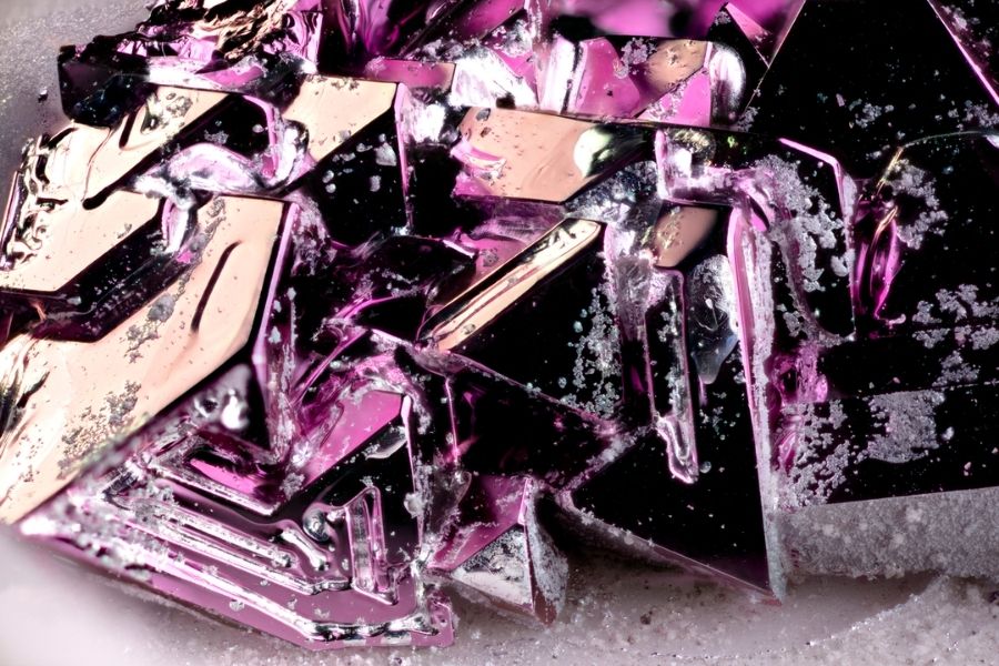 A close-up view of purple metallic crystals.