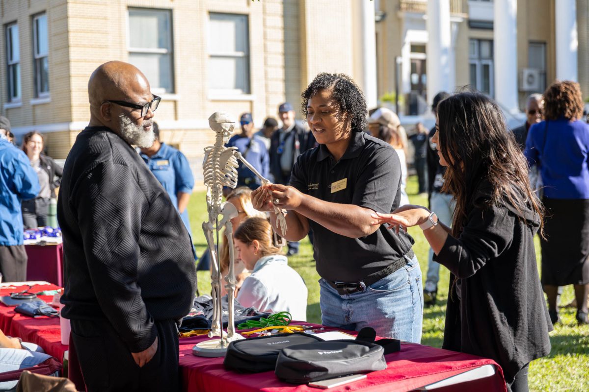 Visitors explore information at the expo. (Photo by Winning Frame Media)