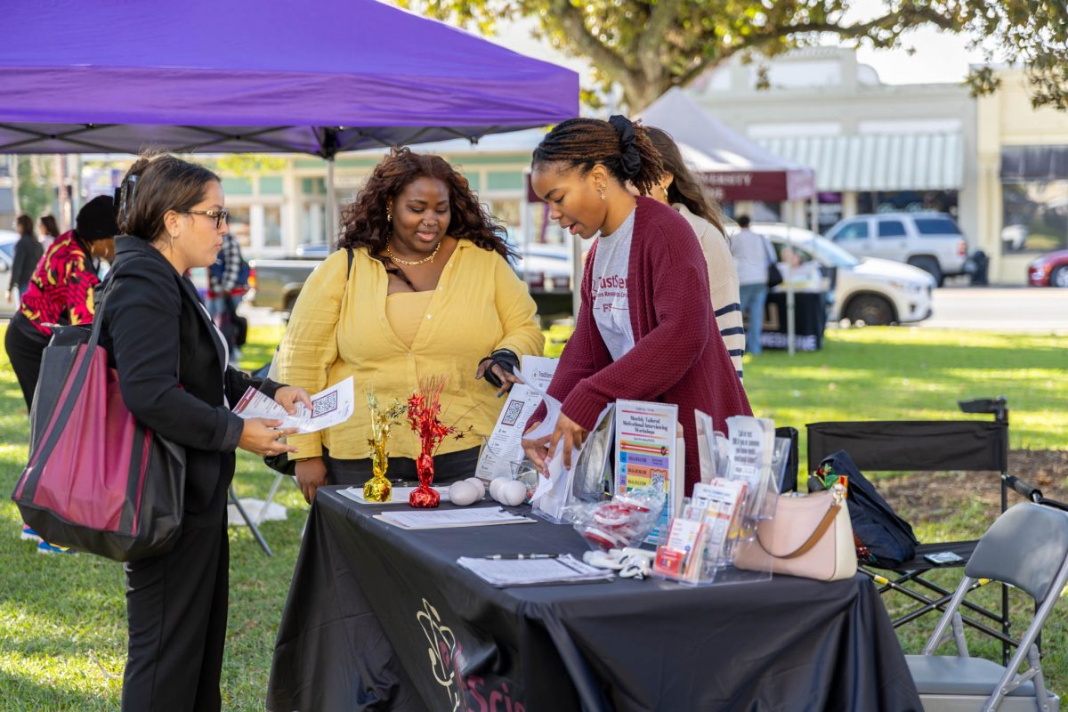 A visitor learns about FSU research at the FSU Health Expo. (Photo by Winning Frame Media)