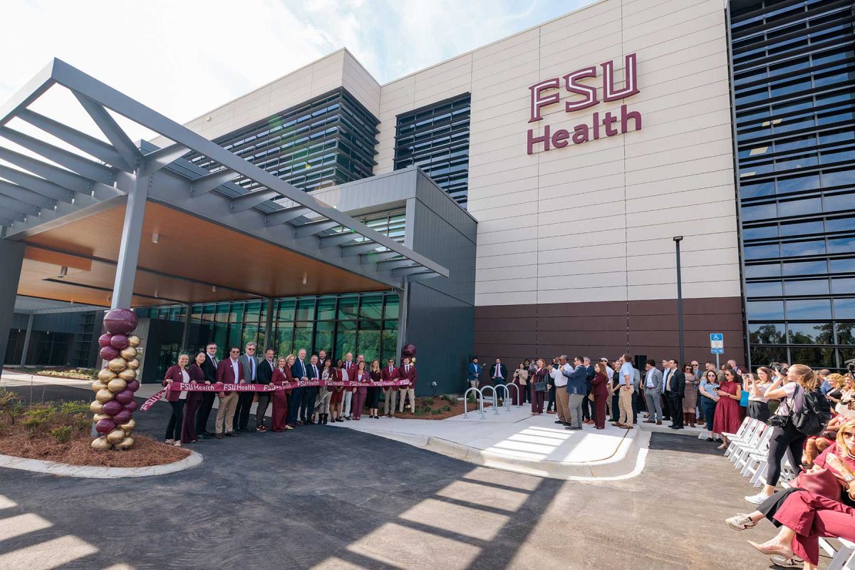FSU President Richard McCullough and Florida Commissioner of Agriculture Wilton Simpson cut the ribbon on the new Wilton Simpson FSU Health Research and Collaboration Building with university leaders and trustees on Oct. 30, 2026. (Bill Lax/Florida State University)