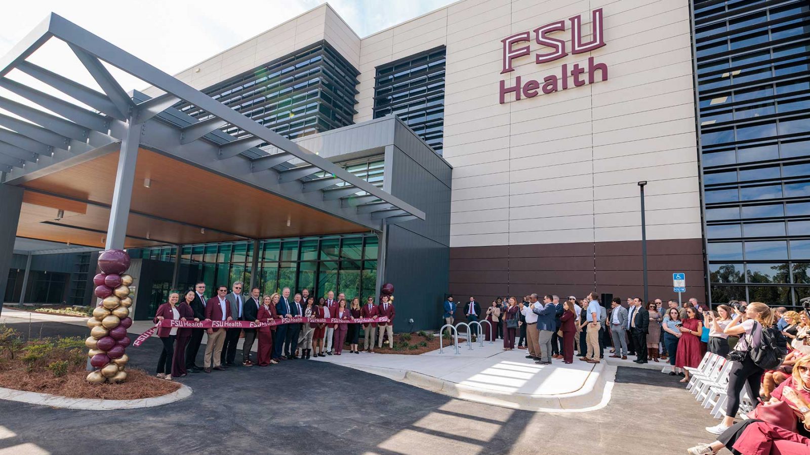 FSU President Richard McCullough and Florida Commissioner of Agriculture Wilton Simpson cut the ribbon on the new Wilton Simpson FSU Health Research and Collaboration Building with university leaders and trustees on Oct. 30, 2026. (Bill Lax/Florida State University)