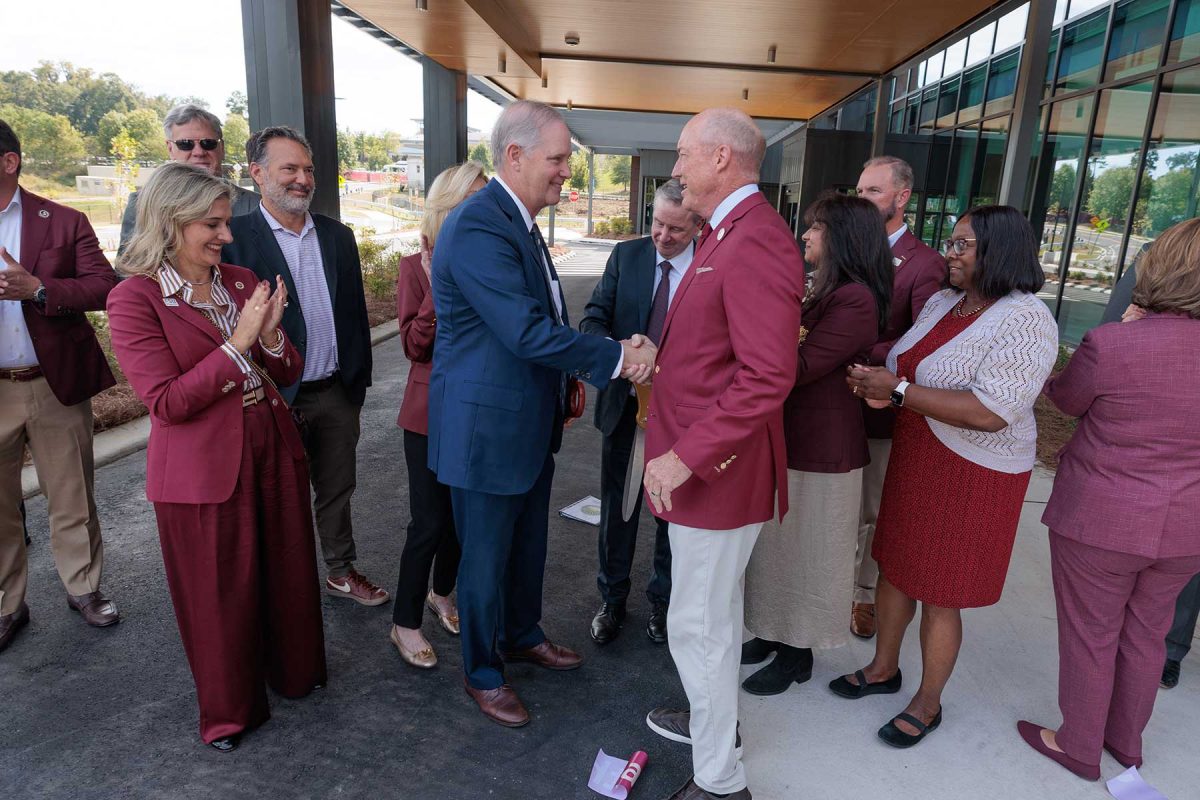FSU BOT Chair Peter Collins shakes hands with Florida Commissioner of Agriculture Wilton Simpson after they cut the ribbon on the new Wilton Simpson FSU Health Research and Collaboration Building on Oct. 30, 2026. (Bill Lax/Florida State University)