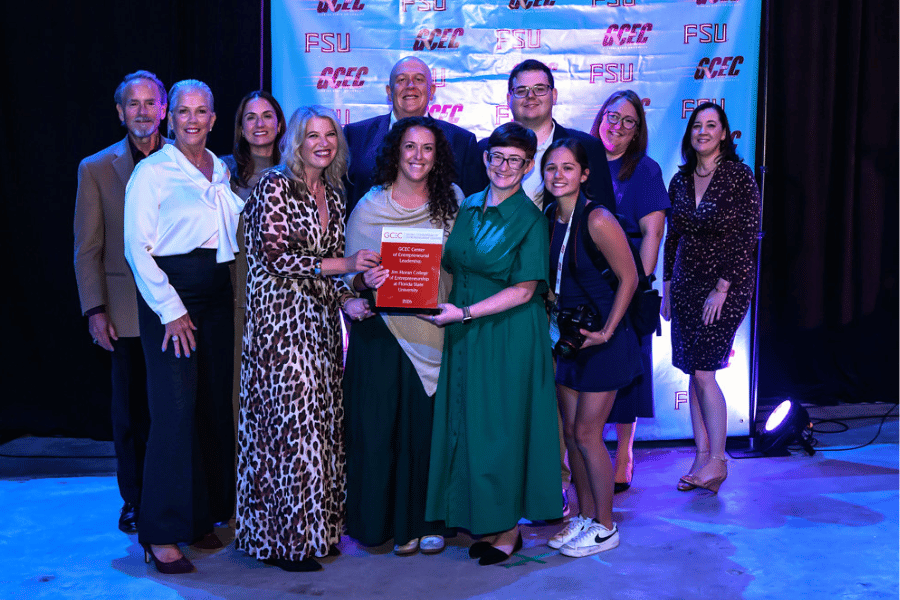 Florida State University personnel winning an award.