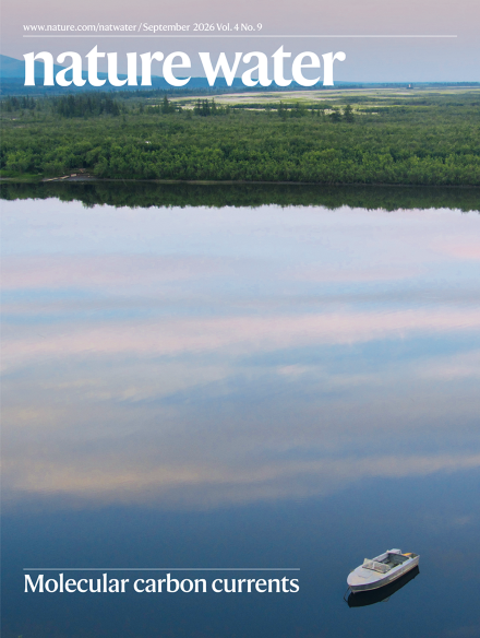 A cover of the journal Nature Water shows a landscape photo featuring woods and alake.
