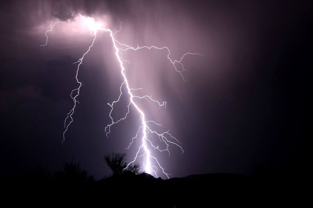Lightning moves through a dark sky.