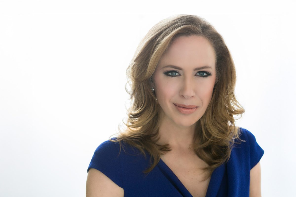 Portrait of Kimberley A. Strassel, a Wall Street Journal columnist and editorial board member, wearing a blue blouse against a white background.