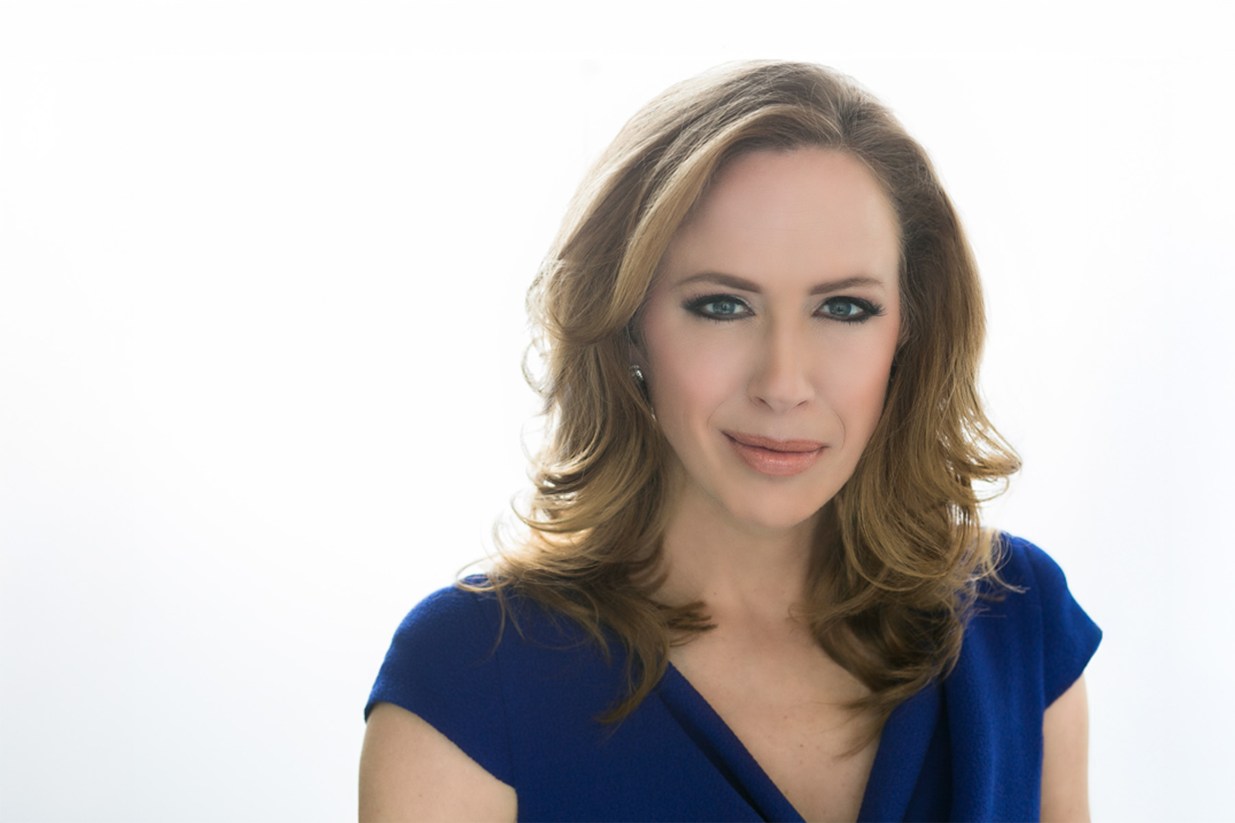 Portrait of Kimberley A. Strassel, a Wall Street Journal columnist and editorial board member, wearing a blue blouse against a white background.